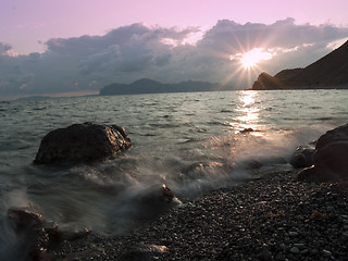 Image showing Sunset at sea shore