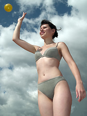 Image showing Girl in bikini throwin ball
