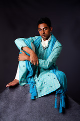 Image showing Hindu man sitting on rock