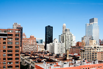 Image showing Building rooftops under blue sky