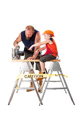 Image showing Dad with son and circle saw