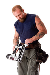 Image showing Man with nail gun