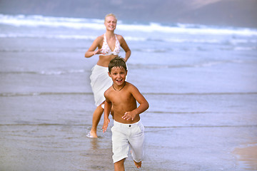 Image showing Happy Mother and son on the beach