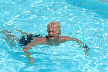 Image showing mature man in the pool 