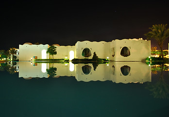 Image showing Oriental style buildings night reflection in pool