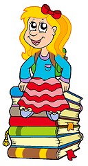 Image showing Girl sitting on pile of books