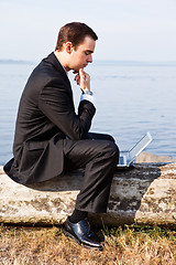 Image showing Caucasian businessman with laptop