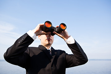 Image showing Caucasian businessman with binoculars