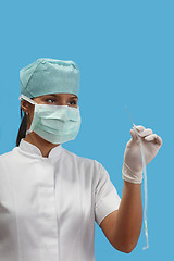 Image showing Nurse holding an arterial catheter