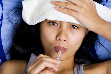 Image showing pretty young woman sick in bed