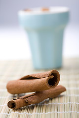 Image showing Cinnamon sticks and cup.