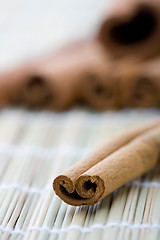 Image showing Cinnamon stick on table mat.