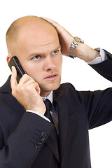 Image showing Businessman with bad news on his cell phone