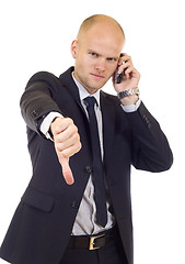 Image showing Businessman with bad news on his cell phone