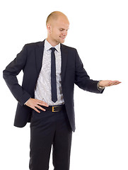 Image showing young cheerful business man presenting