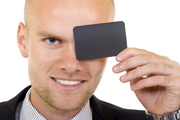 Image showing Young businessman with blank card