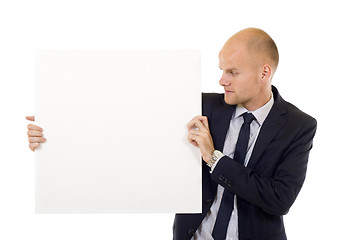 Image showing Businessman holding blank board