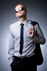 Image showing young businessman looking down to you