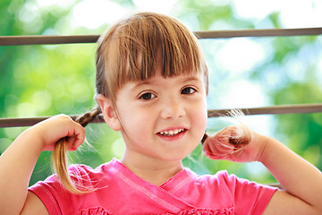 Image showing Little girl with two plaits