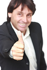 Image showing Happy businessman showing thumb up