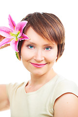 Image showing Positive woman with flower