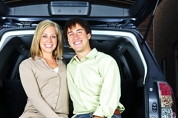 Image showing Couple sitting in back of car