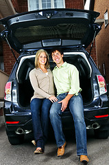 Image showing Couple sitting in back of car