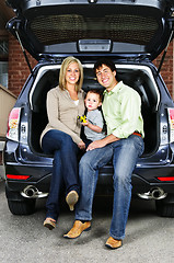 Image showing Family sitting in back of car