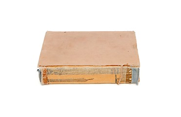 Image showing Old tatty book with torn out cover back isolated