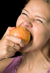 Image showing bitting apple