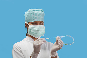 Image showing Nurse opening an arterial catheter