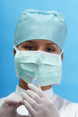 Image showing Nurse holding a syringe