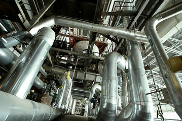 Image showing Equipment, cables and piping as found inside of a modern industr