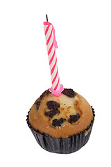 Image showing Raisin muffin with candle