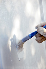 Image showing Painting wooden door