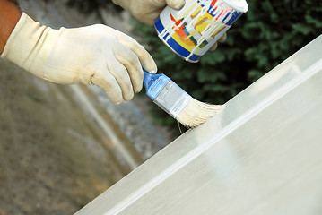 Image showing Painting wooden door