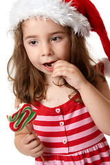 Image showing Little girl eating candy