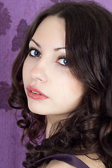 Image showing Portrait of the pretty girl on a violet background