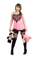 Image showing Pretty girl in a pink dress with plush toys