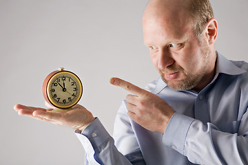 Image showing man with clock