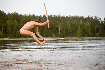 Image showing nude man jumps in water