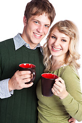 Image showing Caucasian couple holding coffee cups