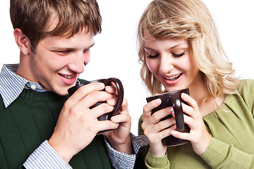 Image showing Caucasian couple holding coffee cups