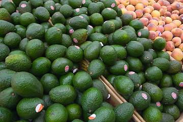 Image showing Avocados over Peaches