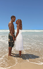 Image showing Romantic African American Couple Holding Hands on the Beach