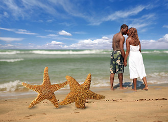 Image showing Romantic Couple Walking Into the Surf