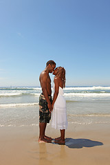 Image showing African American Couple Kissing on the Beach in the Surf