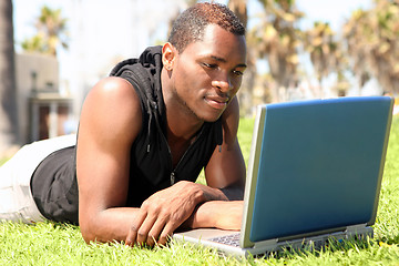 Image showing Student of African Amercian Descent Wotking on a Laptop