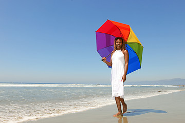 Image showing African American Woman At The Beach Holding an Umbrella