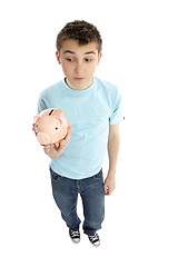 Image showing Boy holding a piggy bank money box